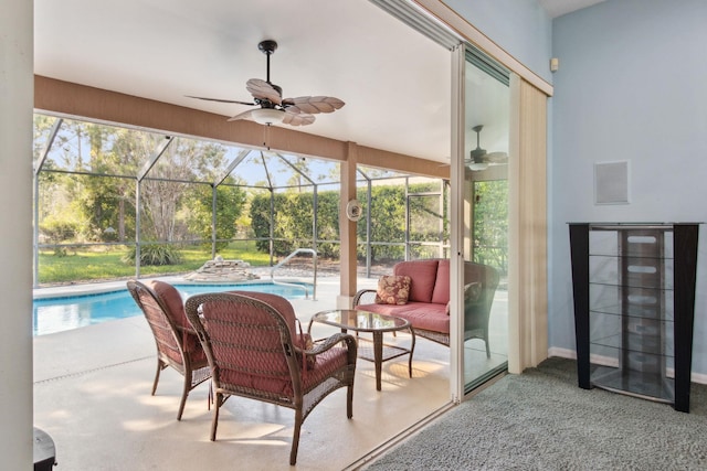 sunroom / solarium featuring ceiling fan and a pool