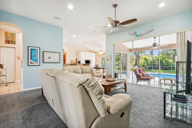 living room featuring light carpet and vaulted ceiling