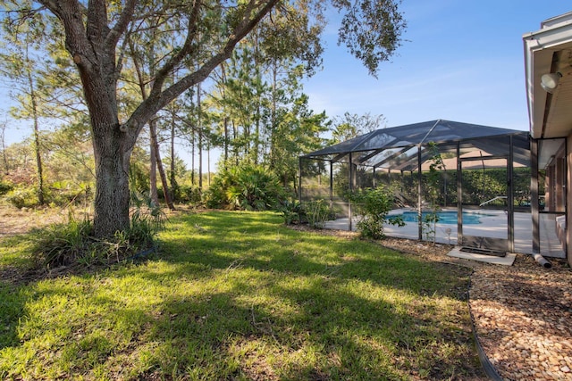 view of yard featuring glass enclosure