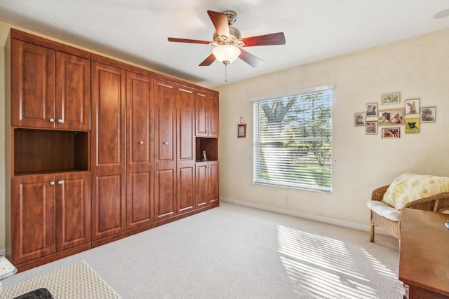 interior space featuring ceiling fan and a closet