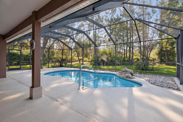 view of swimming pool featuring a patio and glass enclosure