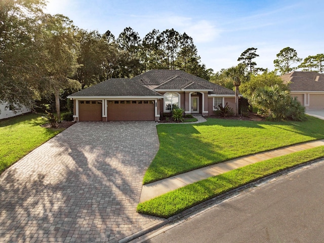 single story home featuring a front yard and a garage