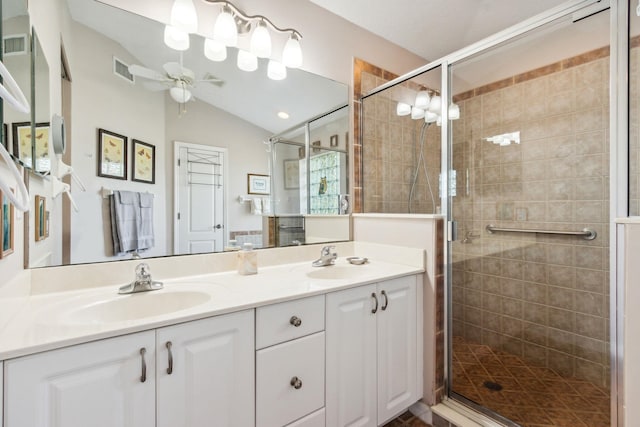 bathroom featuring vanity, ceiling fan, lofted ceiling, and a shower with door