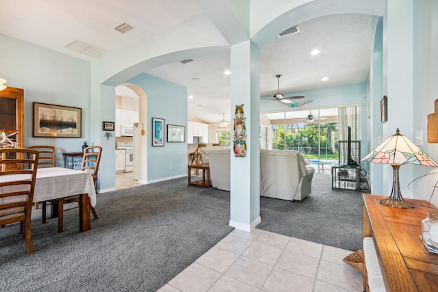 interior space with ceiling fan