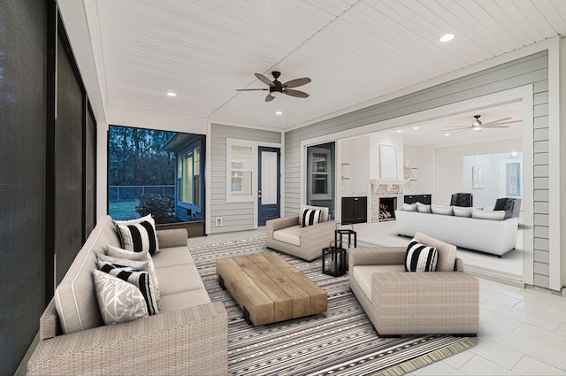 1351 Weaver Glen Rd, Jacksonville, FL 32223 - tiled living room featuring a ceiling fan, a lit fireplace, and recessed lighting