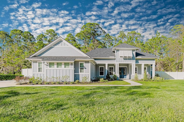 1351 Weaver Glen Rd, Jacksonville, FL 32223 - view of front facade with board and batten siding, french doors, a shingled roof, and a porch