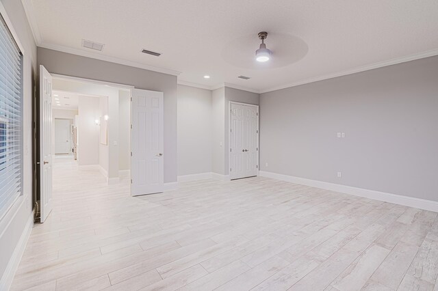 1351 Weaver Glen Rd, Jacksonville, FL 32223 - unfurnished bedroom with light wood finished floors, ornamental molding, a closet, and ceiling fan
