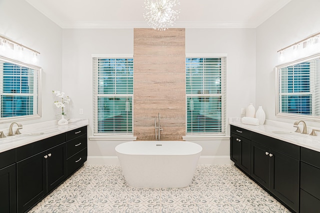 1351 Weaver Glen Rd, Jacksonville, FL 32223 - bathroom featuring two vanities, a freestanding tub, crown molding, a chandelier, and tile patterned flooring
