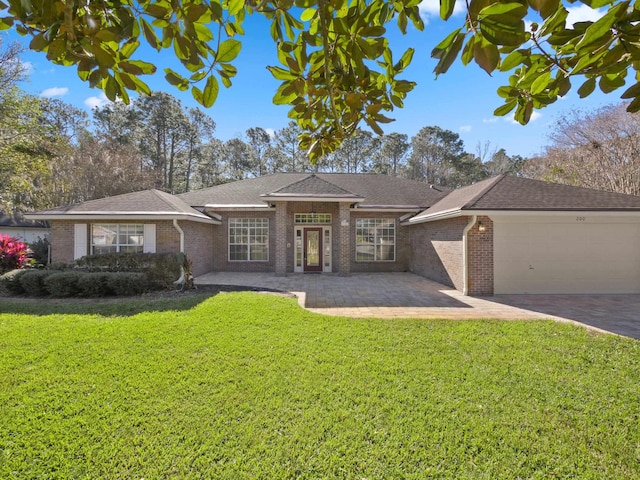200 Springwood Ln, Saint Johns, FL 32259 - view of front of home with a front yard and a garage