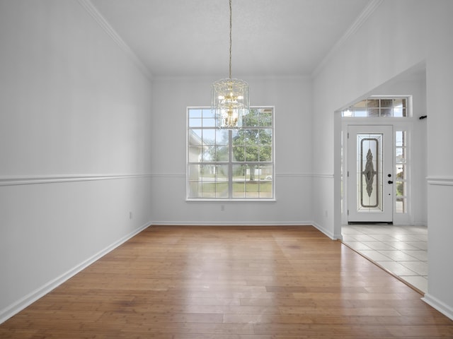 200 Springwood Ln, Saint Johns, FL 32259 - foyer featuring ornamental molding, light hardwood / wood-style flooring, and a notable chandelier