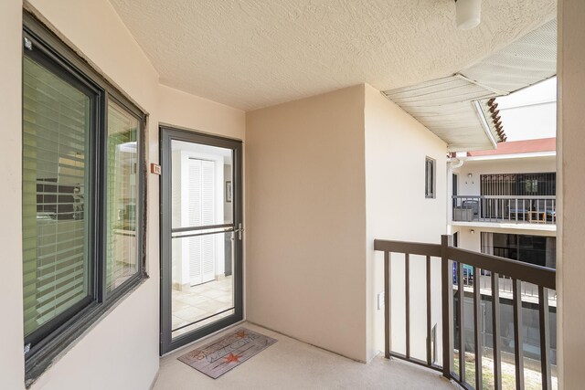 4250 A1A Unit E31, Saint Augustine Beach, FL 32080 - view of exterior entry with a balcony and stucco siding
