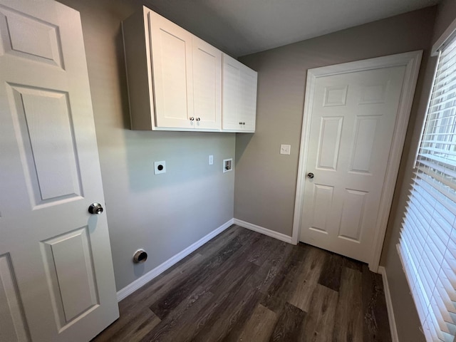 washroom with dark hardwood / wood-style floors, hookup for an electric dryer, hookup for a washing machine, and cabinets