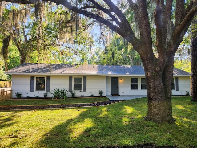 ranch-style home featuring a front yard