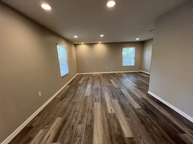 spare room featuring dark hardwood / wood-style floors