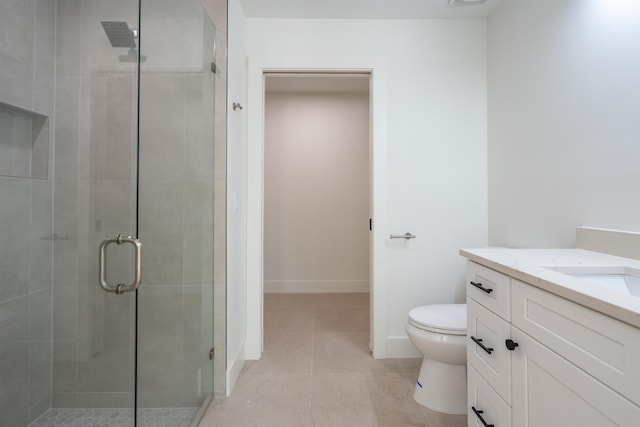 bathroom featuring toilet, baseboards, tile patterned flooring, a shower stall, and vanity