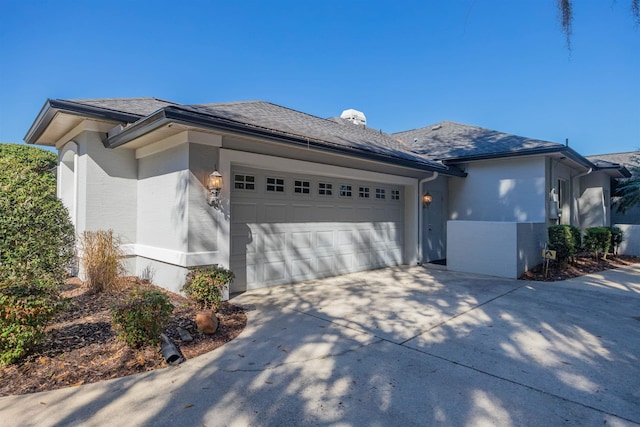 view of side of home with a garage and driveway