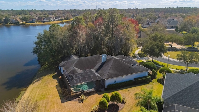 drone / aerial view with a water view and a residential view