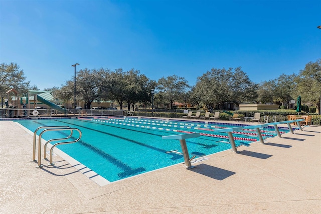 community pool featuring fence