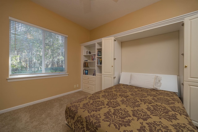 unfurnished bedroom with carpet and baseboards