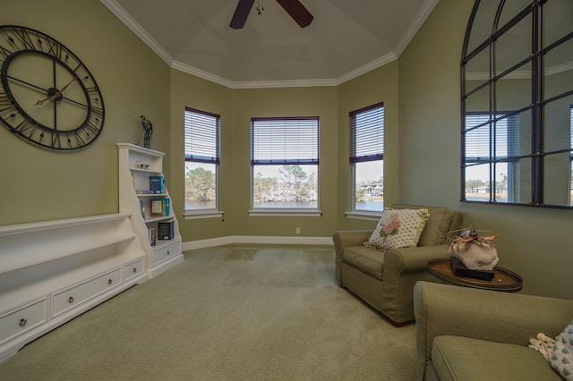 unfurnished room featuring carpet floors, crown molding, baseboards, and ceiling fan