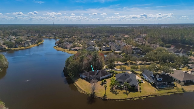 birds eye view of property with a water view and a residential view