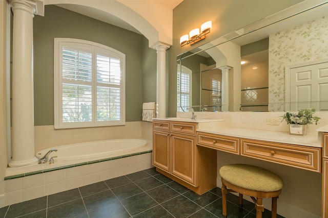 full bathroom featuring a bath, plenty of natural light, tile patterned flooring, and decorative columns