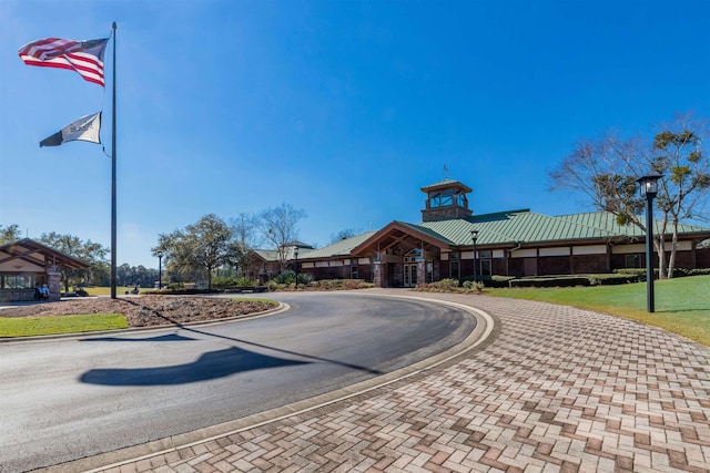 view of building exterior featuring decorative driveway