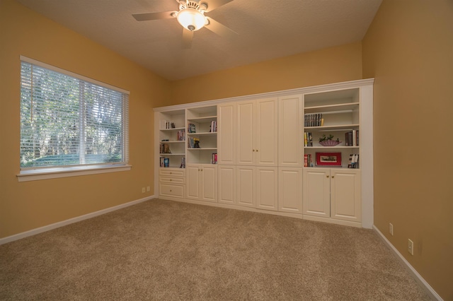 unfurnished bedroom with carpet, vaulted ceiling, and a closet