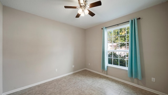 unfurnished room with ceiling fan