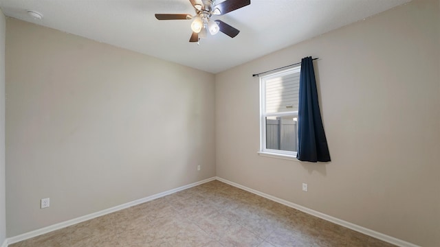 unfurnished room with ceiling fan