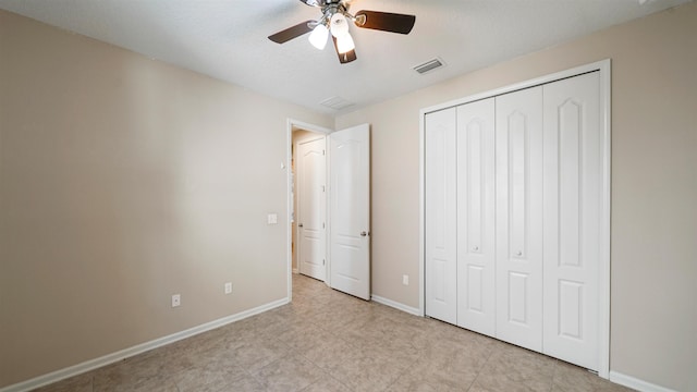 unfurnished bedroom with a closet and ceiling fan