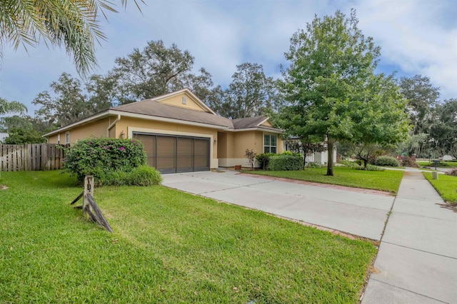 view of front of home featuring a front lawn and a garage