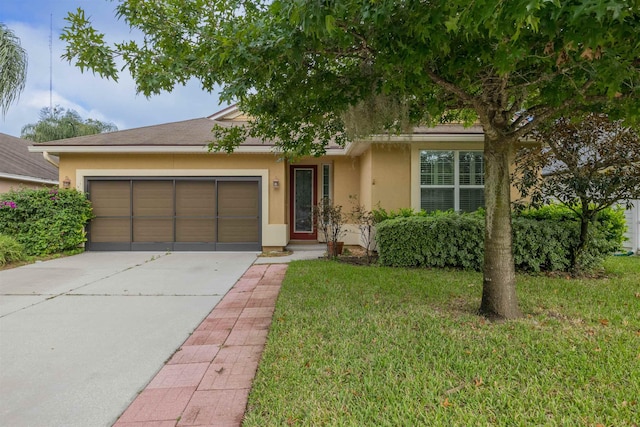 view of front facade with a garage and a front yard