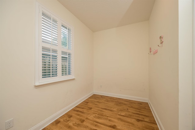 spare room featuring hardwood / wood-style flooring