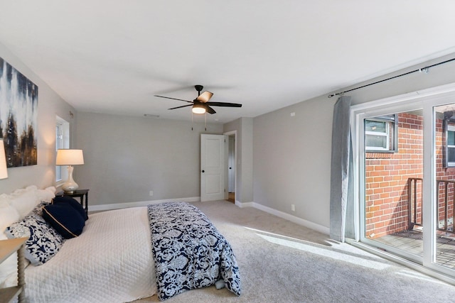 carpeted bedroom featuring access to exterior and ceiling fan