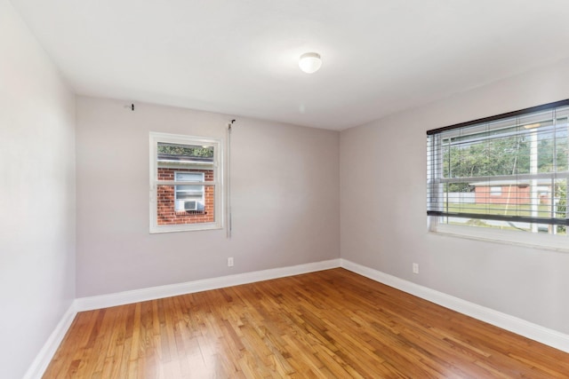 empty room with hardwood / wood-style floors