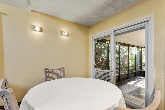 dining area with a textured ceiling