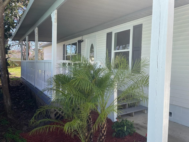 doorway to property with crawl space and covered porch