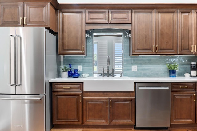 3943 NW 219th St, Rdd, Micanopy, FL 32667 - kitchen featuring appliances with stainless steel finishes, a sink, light countertops, and backsplash