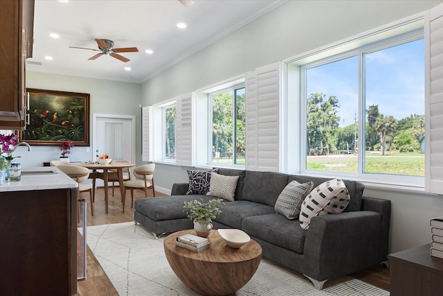 3943 NW 219th St, Rdd, Micanopy, FL 32667 - living room with light wood-style floors, ceiling fan, recessed lighting, and ornamental molding
