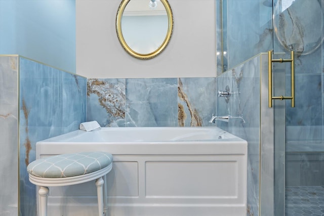 3943 NW 219th St, Rdd, Micanopy, FL 32667 - bathroom featuring tile walls, a garden tub, and a stall shower