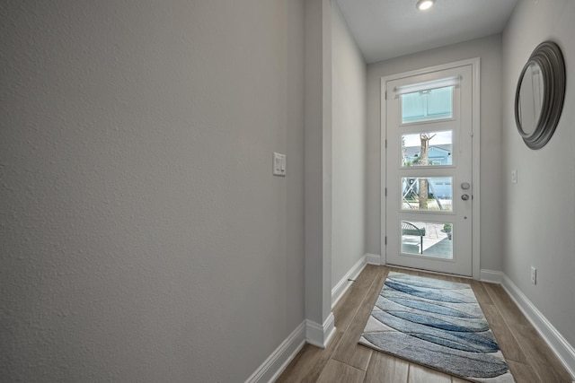 doorway with light hardwood / wood-style floors