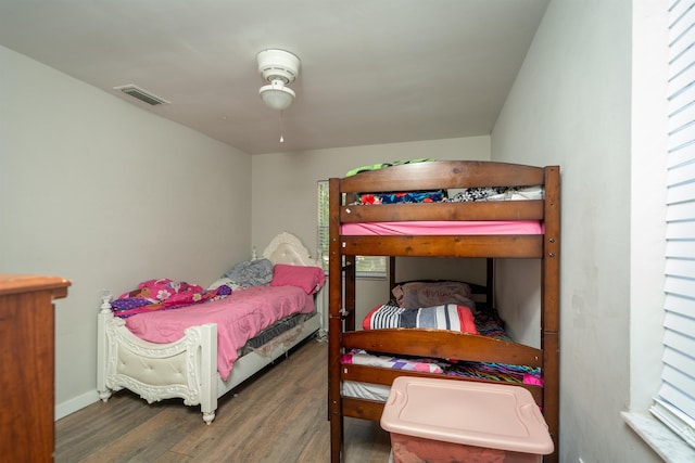 bedroom featuring ceiling fan and dark wood-type flooring