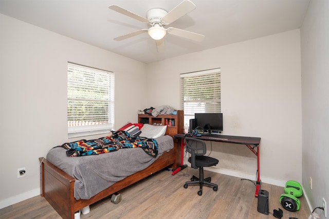 bedroom featuring wood-type flooring and ceiling fan