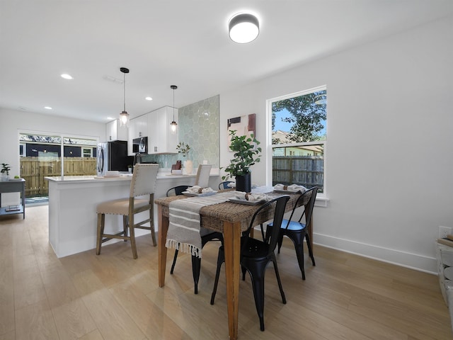 dining space featuring light hardwood / wood-style flooring