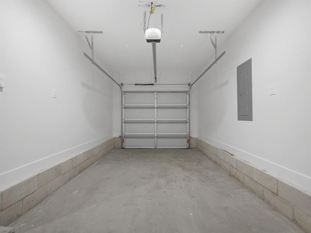 garage featuring a garage door opener and electric panel