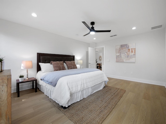 bedroom featuring ceiling fan and light hardwood / wood-style floors