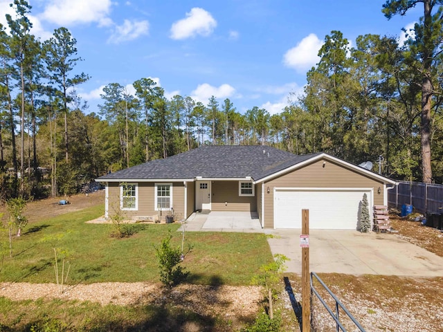 single story home featuring a garage and a front yard