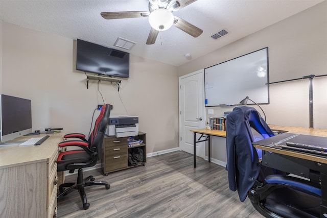 office featuring hardwood / wood-style floors, a textured ceiling, and ceiling fan