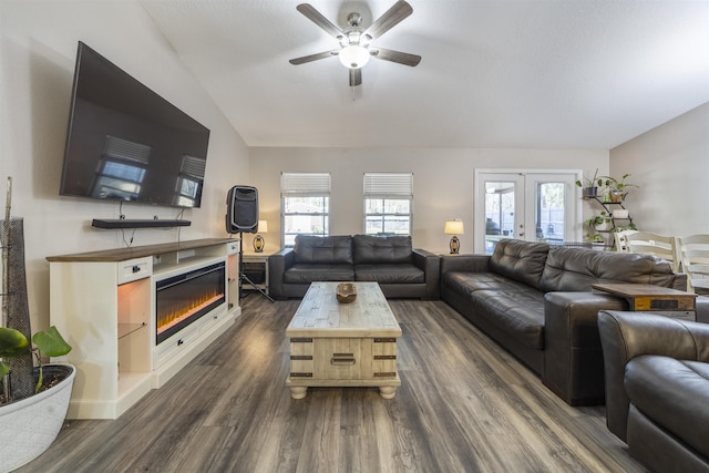 living room featuring ceiling fan, french doors, and dark hardwood / wood-style floors